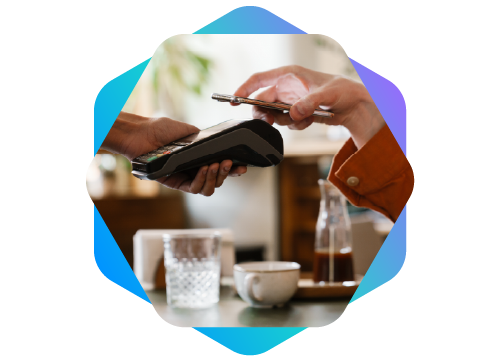 Foto de um celular sendo aproximado de uma maquininha de pagamento.